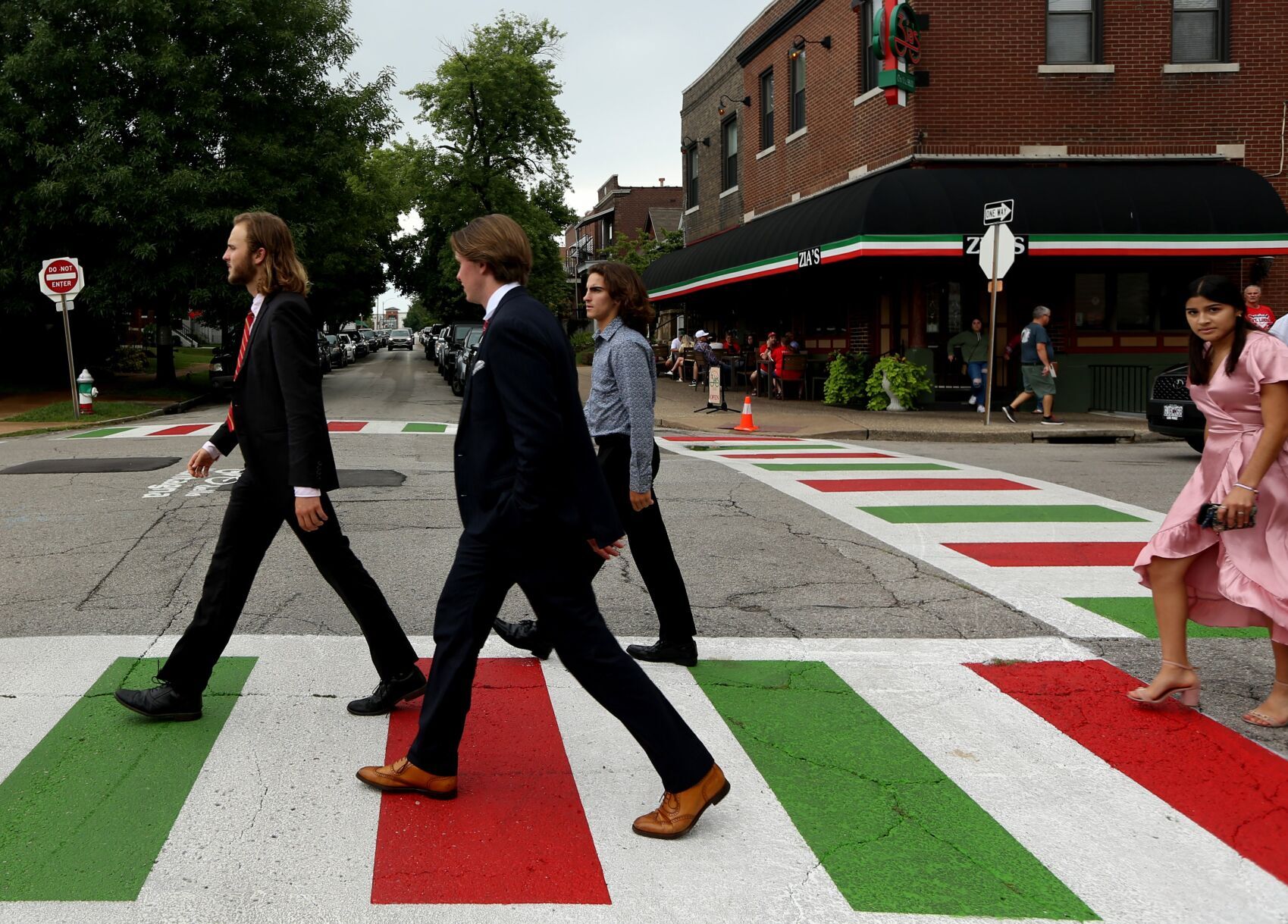 Residents enjoying newly painted red, white and green crosswalks on The Hill
